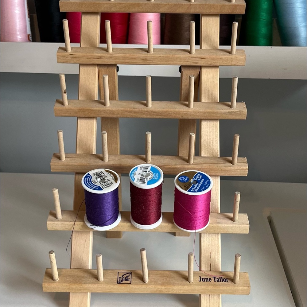Wooden Thread Rack with Purple and Pink Spools